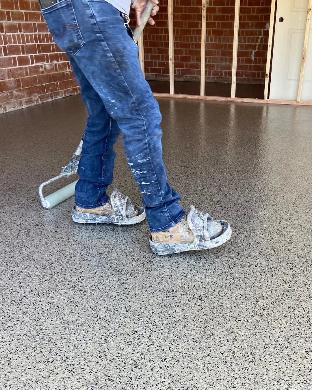 StepSafe applicator rolling a fleck coating on site