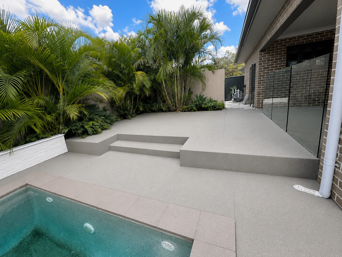 Finished pool deck and steps with anti-slip surface
